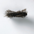 Brosche, „Small Hairy Black Caterpillar“, 1999. Ebenholz, geschnitzt; Haare, Gold. L 4,3 cm, B 2 cm, H 1,5 cm